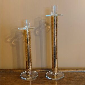 Candlesticks made of glass, so elegant and classy! 12 and 10.5 inches tall.
